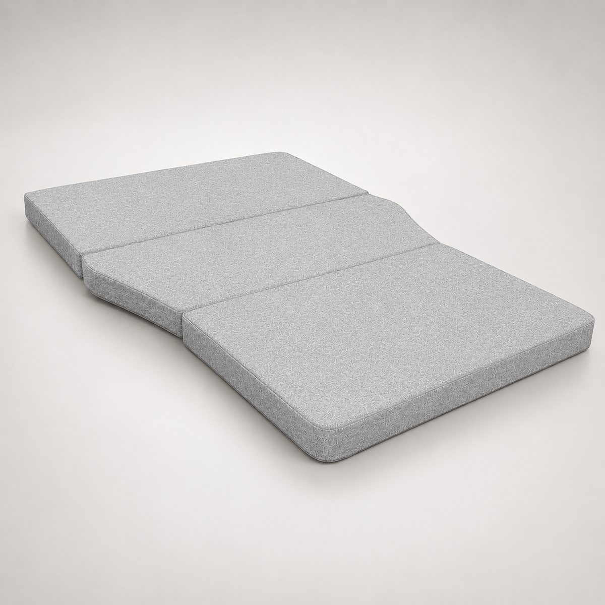 Sammenfoldet skummadras med memory foam set fra siden