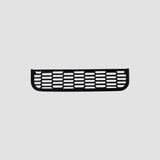 Sort ventilation cover til Tesla Model 3/Y vist mod grå baggrund.