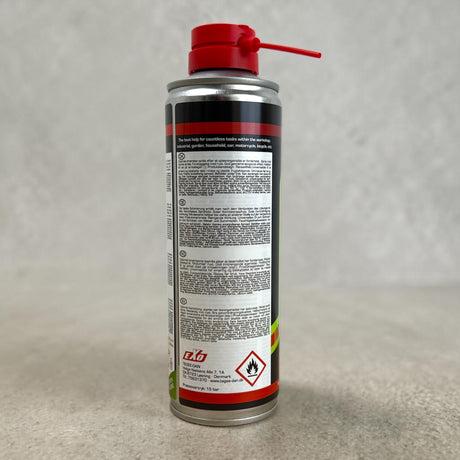 Bagsiden af EXO 9 Universal Oil 250 ml. dåse med brugsanvisning og faresymbol