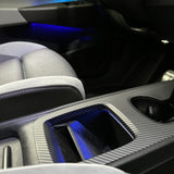 Midterkonsol cover i mat carbonfiber monteret i VW ID.3 med blåt kabinelys