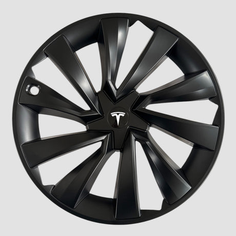 MV Spiral hjulkapsel med hvidt Tesla-logo set frit stillet uden bil