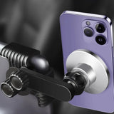 Nærbillede af lilla iPhone fastgjort med magnet på sort telefonholder
