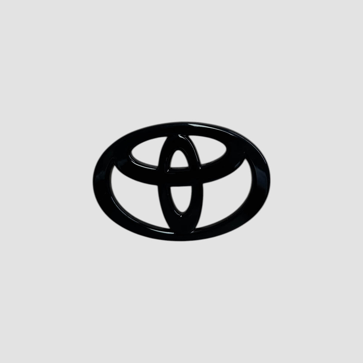 Emblem cover i mat sort til Toyota bZ4X's bagemblem